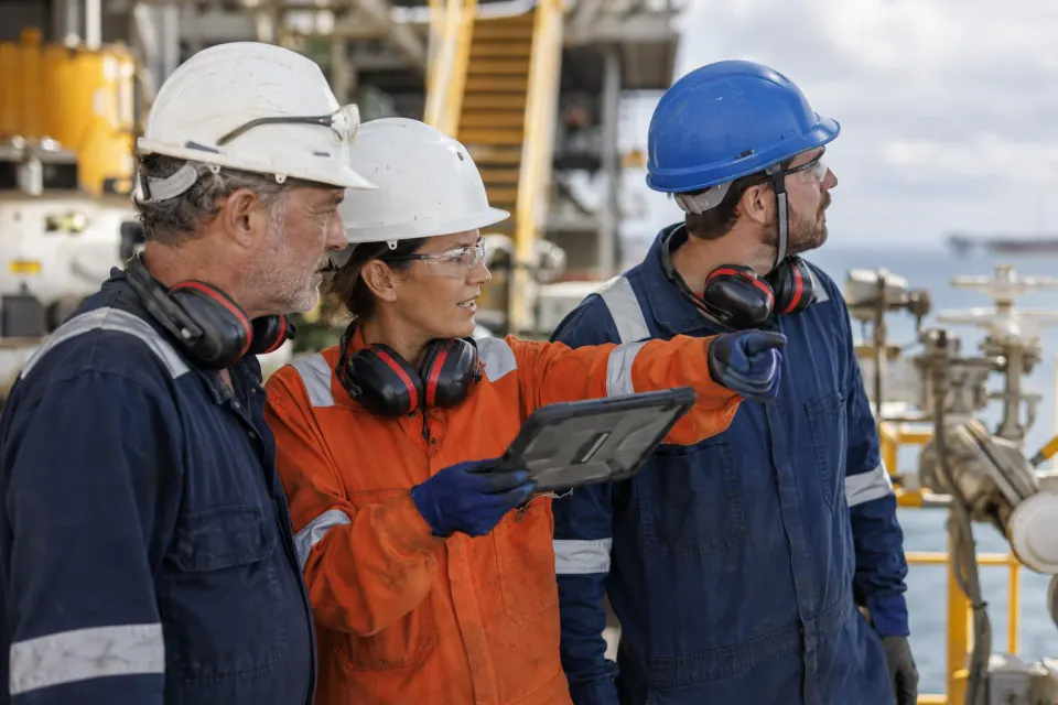 Aurion+ offshore team reviewing an inspection on a platform deck